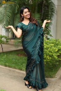 actress Mokksha cute in a green saree