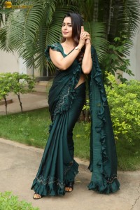 actress Mokksha cute in a green saree
