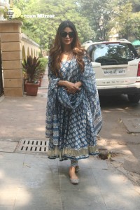 Actress Mouni Roy in a salwar dress and sun glasses