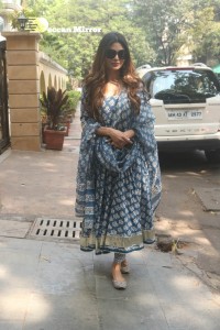 Actress Mouni Roy in a salwar dress and sun glasses