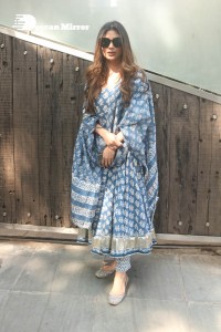 Actress Mouni Roy in a salwar dress and sun glasses