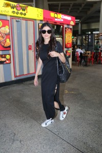 Actress Mouni Roy in a black slit dress at Airport