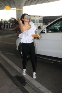 Mouni Roy at Airport in a white top