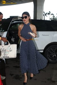 bollywood actress mouni roy in a shoulderless dress at airport