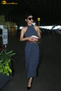 bollywood actress mouni roy in a shoulderless dress at airport
