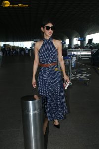 bollywood actress mouni roy in a shoulderless dress at airport