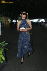 bollywood actress mouni roy in a shoulderless dress at airport