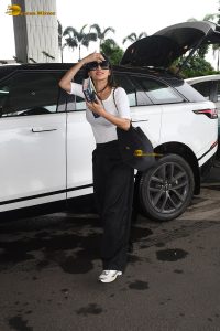 bollywood actress Mouni Roy pretty in a white top