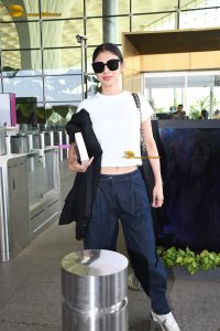 actress mouni roy pretty in a white t-shirt at airport