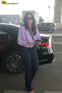 actress mrunal thakur in a purple shirt at airport