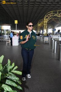 actress Mrunal Thakur stylish in a green jumper