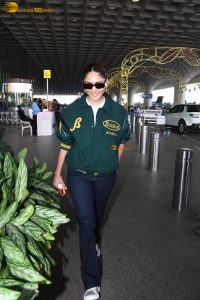 actress Mrunal Thakur stylish in a green jumper