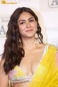 Actress Mrunal Thakur hot look in a yellow lehenga choli