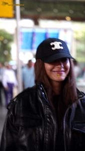 actress Mrunal Thakur stylish in a cap and jacket at mumbai airport