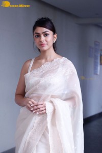 Actress Mrunal Thakur in a white saree