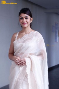 Actress Mrunal Thakur in a white saree