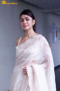 Actress Mrunal Thakur in a white saree