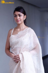 Actress Mrunal Thakur in a white saree