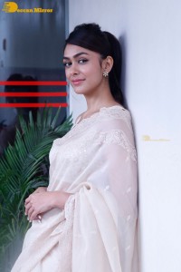 Actress Mrunal Thakur in a white saree
