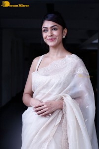 Actress Mrunal Thakur in a white saree