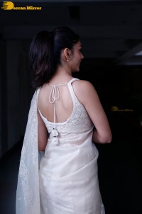 Actress Mrunal Thakur in a white saree