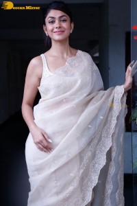 Actress Mrunal Thakur in a white saree
