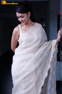 Actress Mrunal Thakur in a white saree