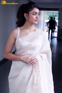 Actress Mrunal Thakur in a white saree