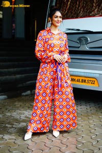 Actress Mrunal Thakur in a orange dress