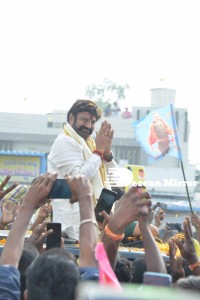 Nandamuri Balakrishna and Boyapati Srinu offer prayers at Pedakakani temple and fans throng to see them outside