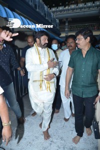Balakrishna Nandamuri and Boyapati Srinu in Vijayawada to pray at the Temple for Akhanda movie success. Fans throng to see them.