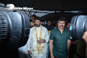 Balakrishna Nandamuri and Boyapati Srinu in Vijayawada to pray at the Temple for Akhanda movie success. Fans throng to see them.