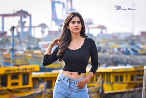 Telugu Actress Nabha Natesh in a black top and blue jeans