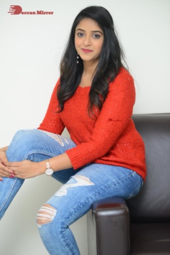 Telugu Actress Nakshatra photoshoot in a orange top and jeans