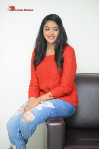 Telugu Actress Nakshatra photoshoot in a orange top and jeans