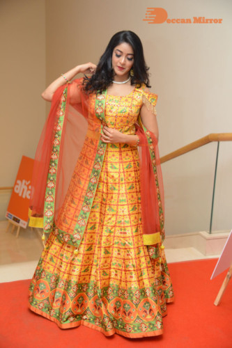 Telugu Actress Nakshatra photoshoot in a yellow Lehenga Choli dress