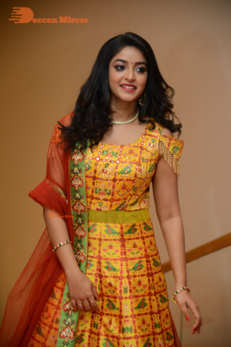 Telugu Actress Nakshatra photoshoot in a yellow Lehenga Choli dress