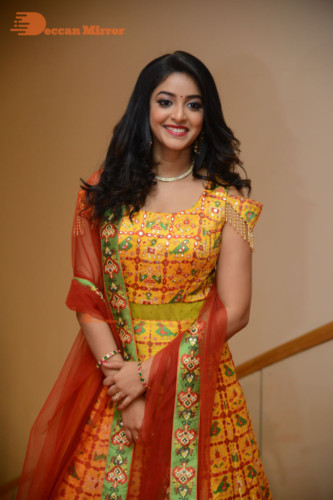 Telugu Actress Nakshatra photoshoot in a yellow Lehenga Choli dress