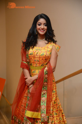 Telugu Actress Nakshatra photoshoot in a yellow Lehenga Choli dress