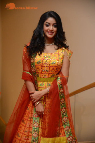 Telugu Actress Nakshatra photoshoot in a yellow Lehenga Choli dress
