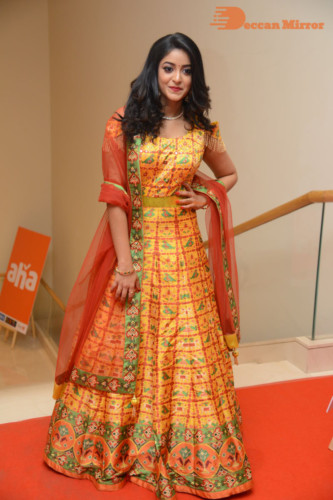 Telugu Actress Nakshatra photoshoot in a yellow Lehenga Choli dress