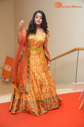 Telugu Actress Nakshatra photoshoot in a yellow Lehenga Choli dress