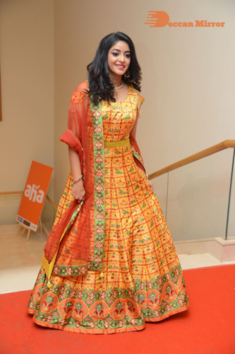 Telugu Actress Nakshatra photoshoot in a yellow Lehenga Choli dress