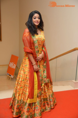 Telugu Actress Nakshatra photoshoot in a yellow Lehenga Choli dress