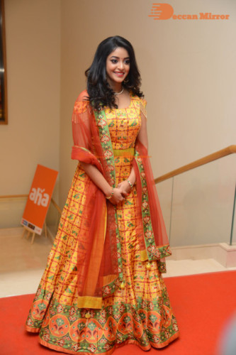 Telugu Actress Nakshatra photoshoot in a yellow Lehenga Choli dress