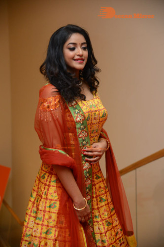 Telugu Actress Nakshatra photoshoot in a yellow Lehenga Choli dress
