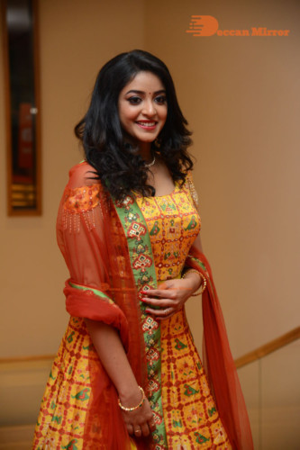 Telugu Actress Nakshatra photoshoot in a yellow Lehenga Choli dress