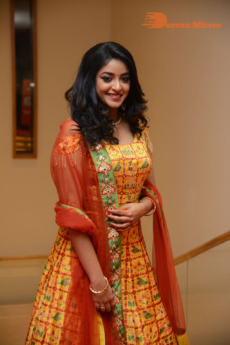 Telugu Actress Nakshatra photoshoot in a yellow Lehenga Choli dress