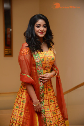 Telugu Actress Nakshatra photoshoot in a yellow Lehenga Choli dress