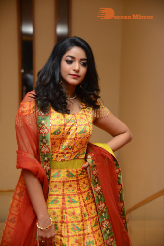 Telugu Actress Nakshatra photoshoot in a yellow Lehenga Choli dress